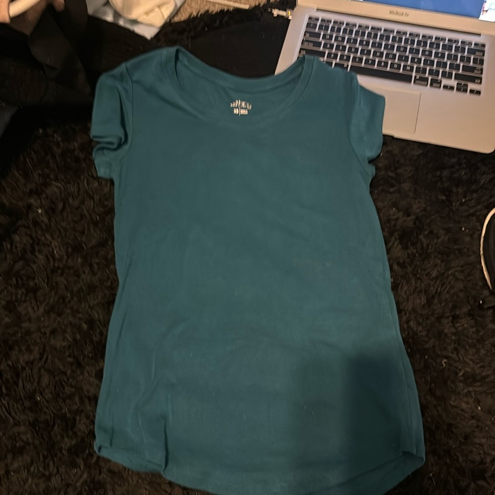 This is a dark blueish bcg shirt in a size xs.